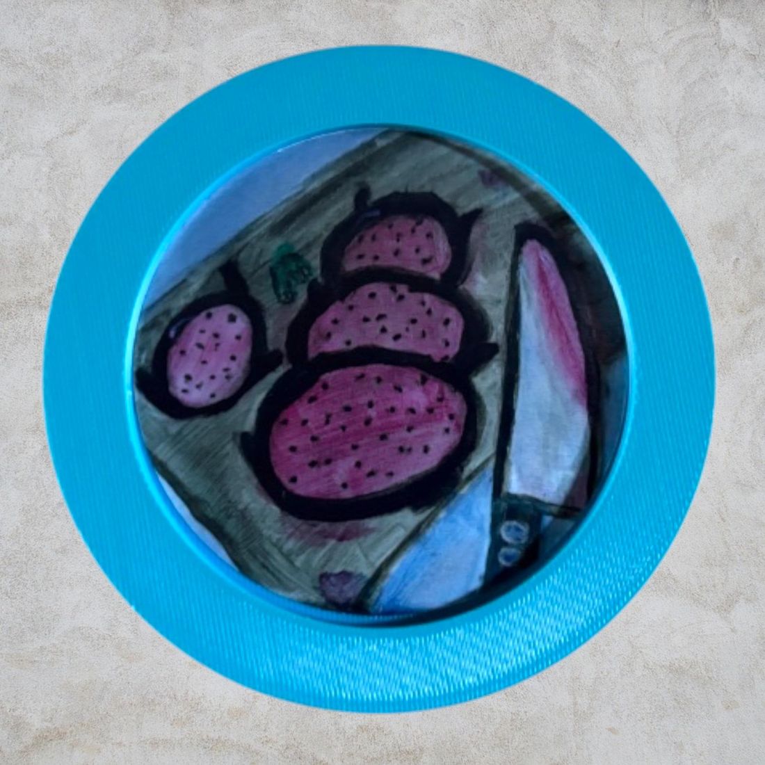 A round coaster printed with a painting of a dragon fruit